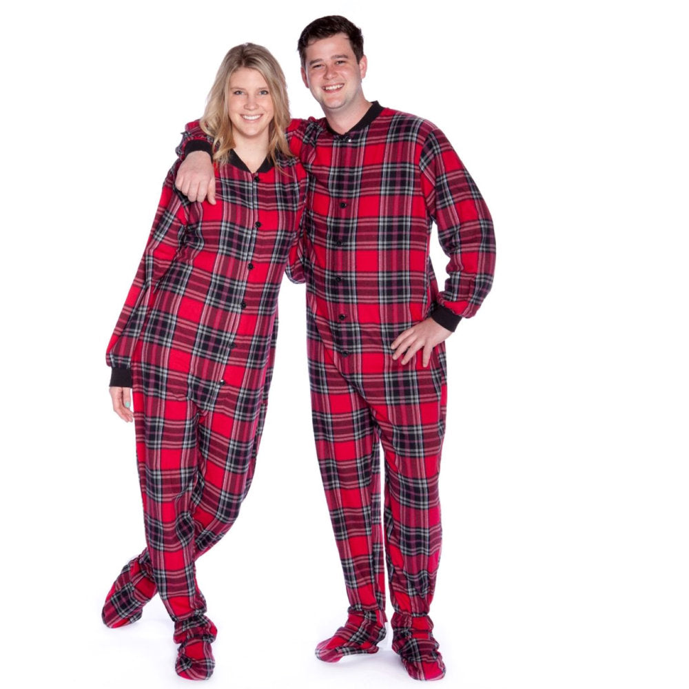 A man and a woman couple wearing Red and Black Plaid Adult Footed Onesie Pajamas from Big Feet Pajama Company