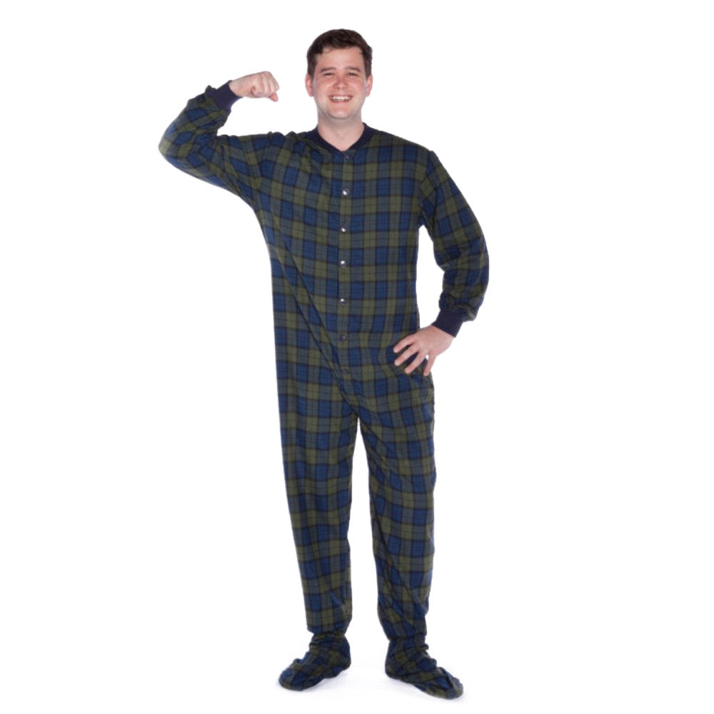 A man wearing Navy Blue and Green Plaid Adult Footed Onesie Pajamas from Big Feet Pajama Company