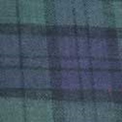Close-up fabric swatch Big Feet Pajama Co  Navy Blue & Green Tartan Plaid Cotton Flannel for their Women's 2-piece pajama sets and their unisex adult footed onesie pajamas & loungewear.