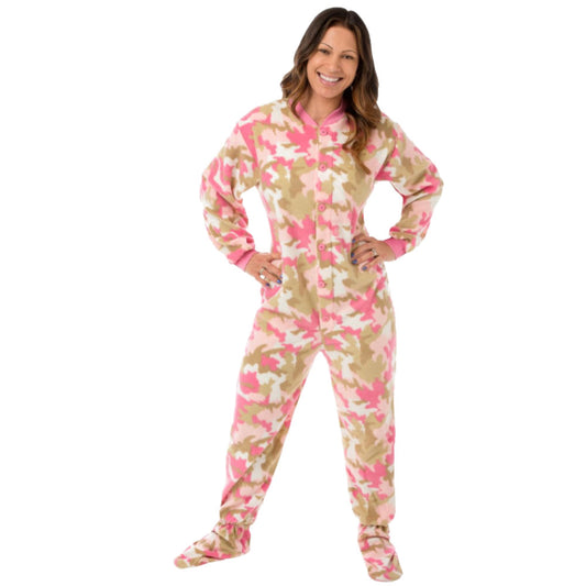 A woman smiling with hands on hips wearing Pink Camouflage Fleece Adult Onesie Footed Pajamas for Women from Big Feet Pajamas