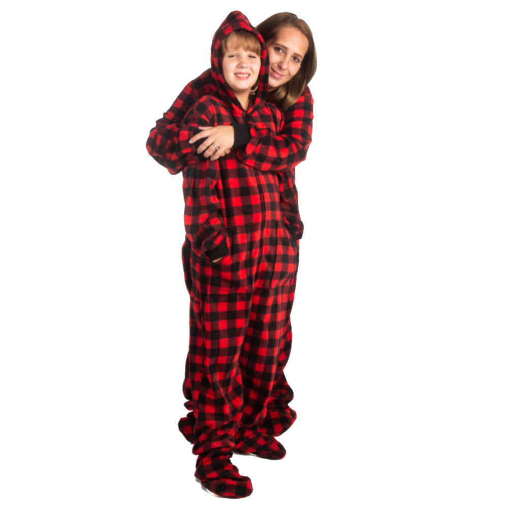 A woman hugging her daughter, both wearing Matching Red and Black Buffalo Plaid Fleece Footed Onesie Pajamas from Big Feet Pajama Company