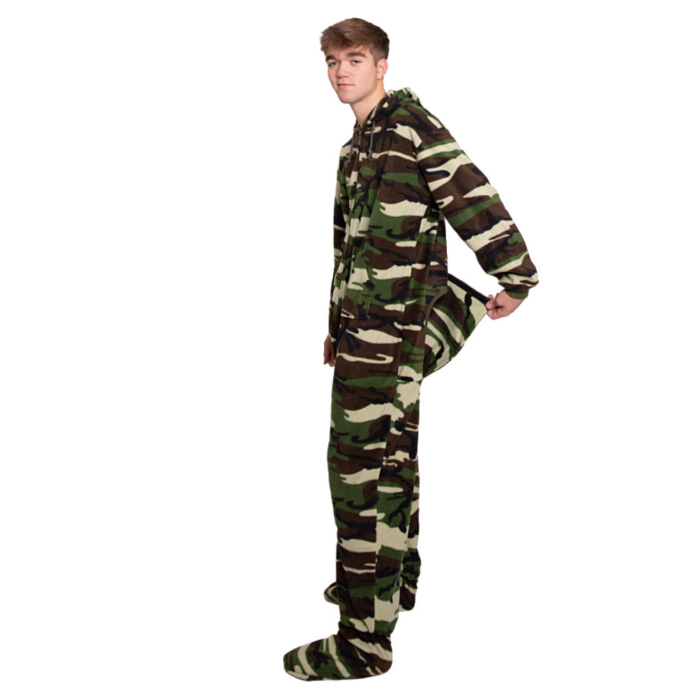 A man standing and showing the drop seat on the back of his Green Camouflage Fleece Adult Onesie Hoodie Footed Pajamas from Big Feet PJs.