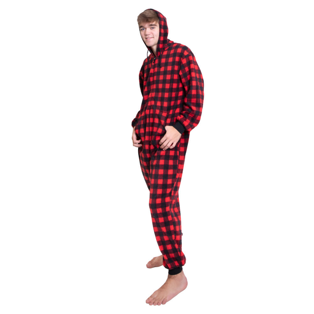 A man wearing Red & Black Buffalo Plaid Fleece Adult Onesie Hoodie Jumpsuit with his hands in the pockets and his hood up, from Big Feet Pajama Company.