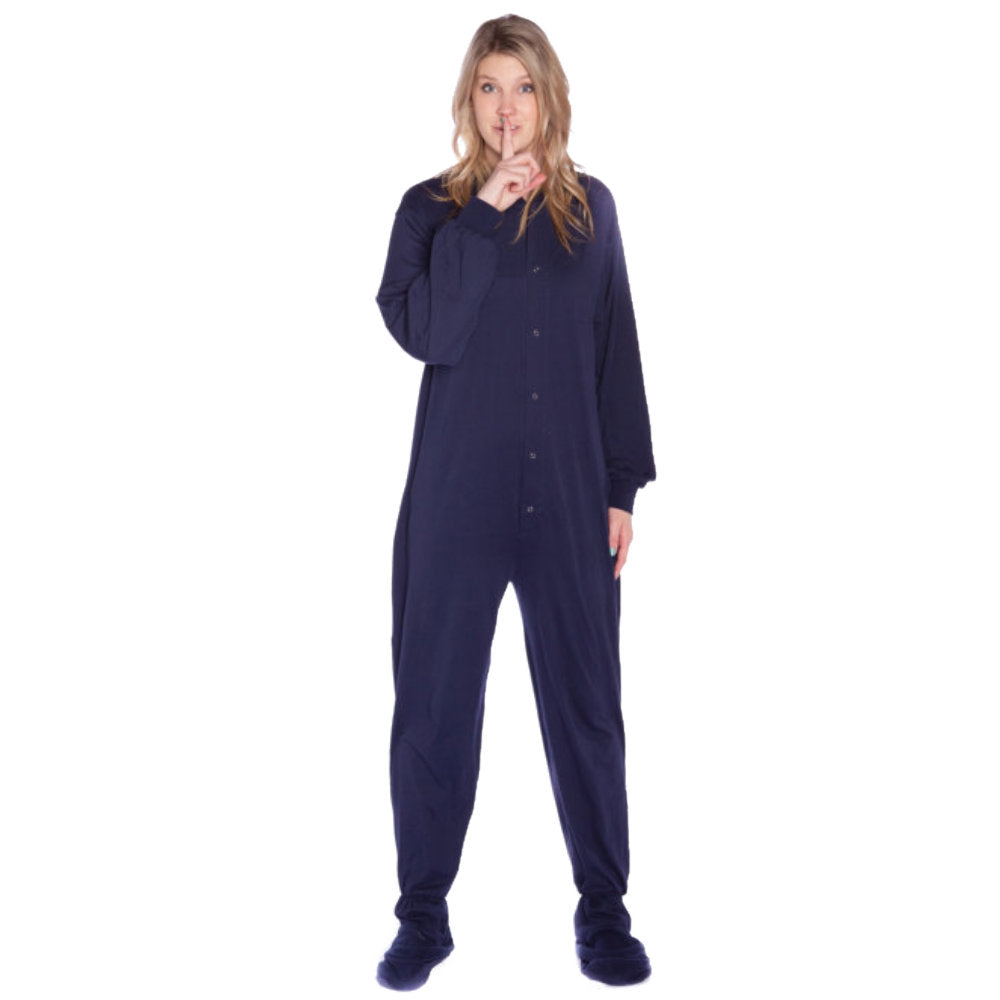 A woman with a secret wearing Navy Blue Cotton Knit Adult Onesie Footed Pajamas for Men & Women from Big Feet Pajama Company.