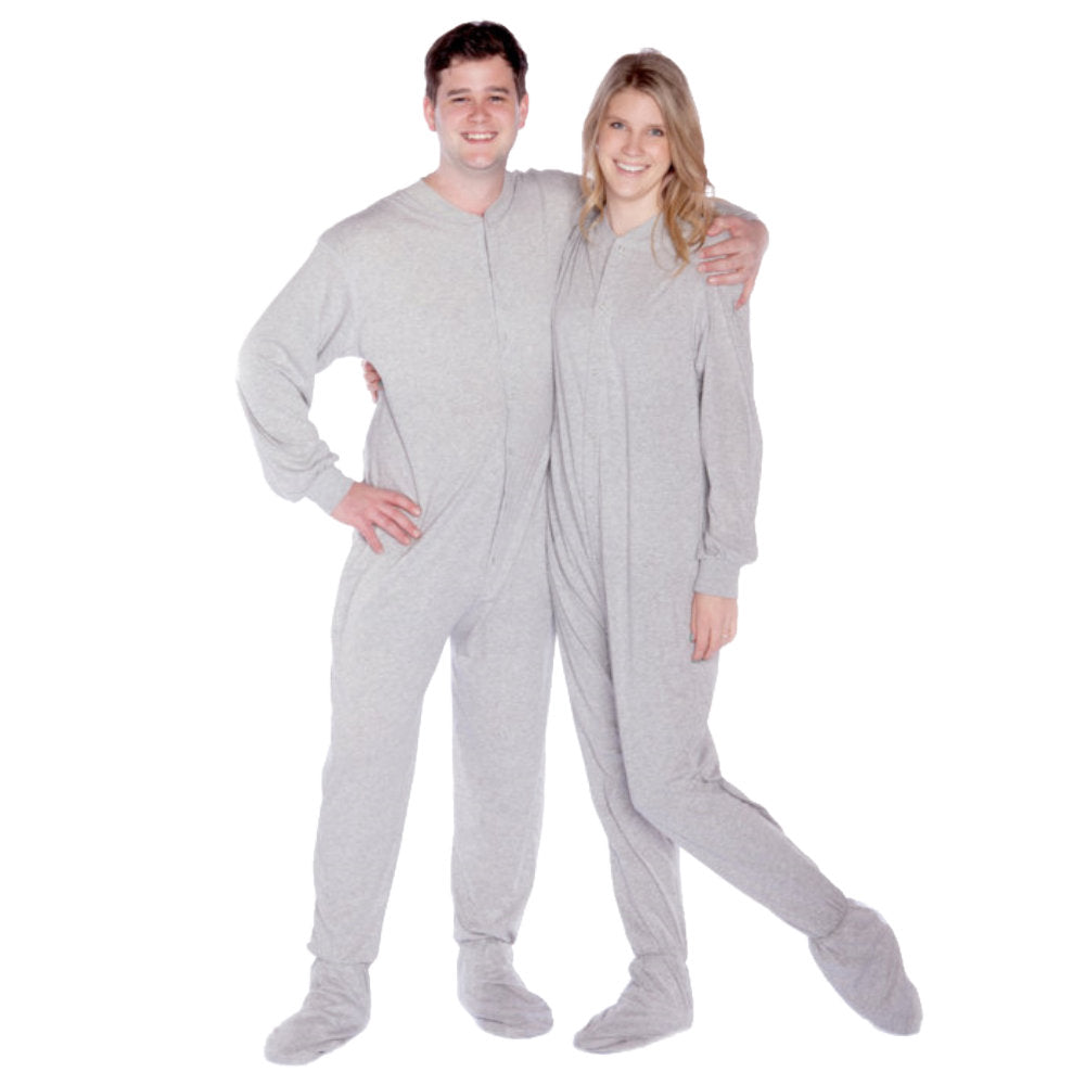 A couple wearing Heather Gray Cotton Knit Adult Onesie Footed Pajamas for Men & Women from Big Feet Pajama Company.