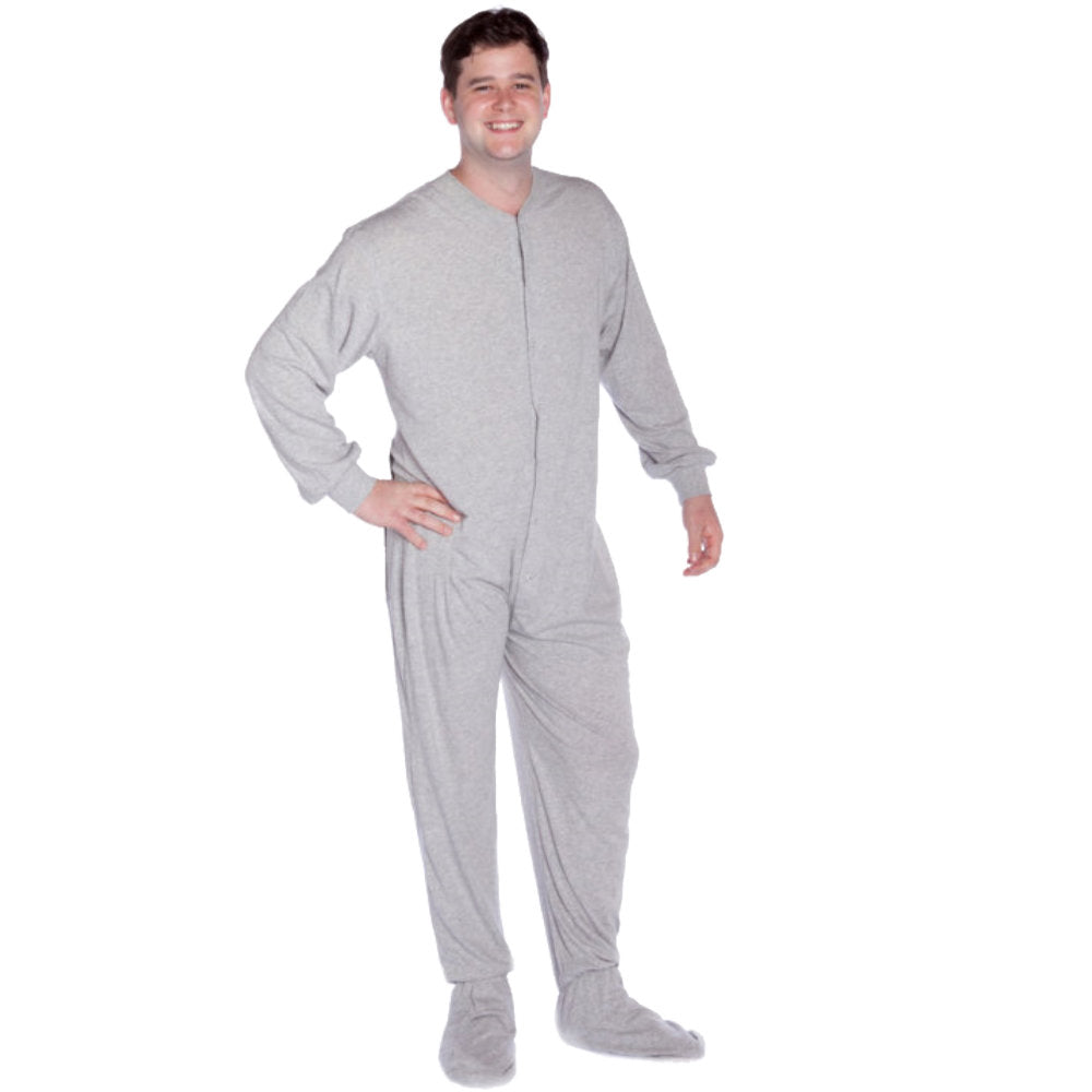 A man wearing light heather gray Cotton Knit Adult Onesie Footed Pajamas for Men & Women from Big Feet Pajama Company.