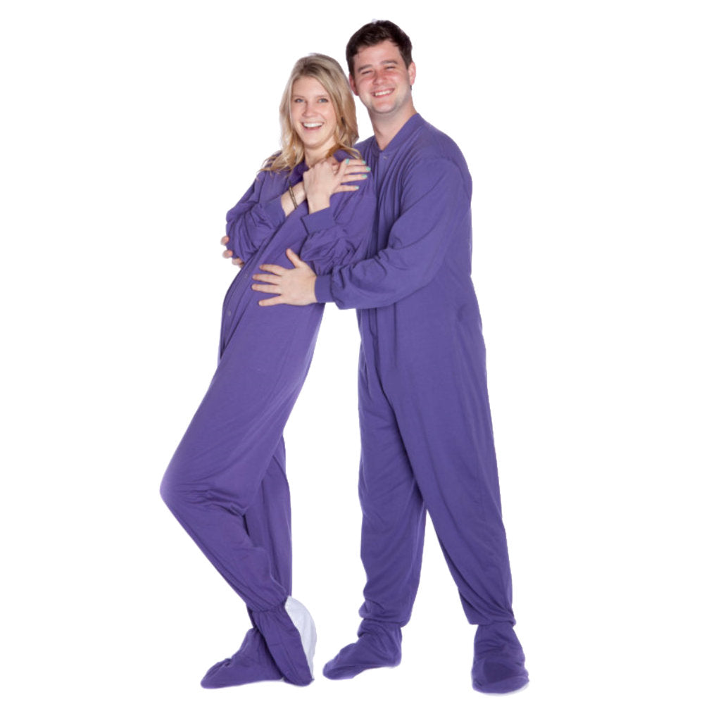 A couple wearing Purple Cotton Knit Matching Adult Onesie Footed Pajamas for Men & Women from Big Feet Pajama Company.