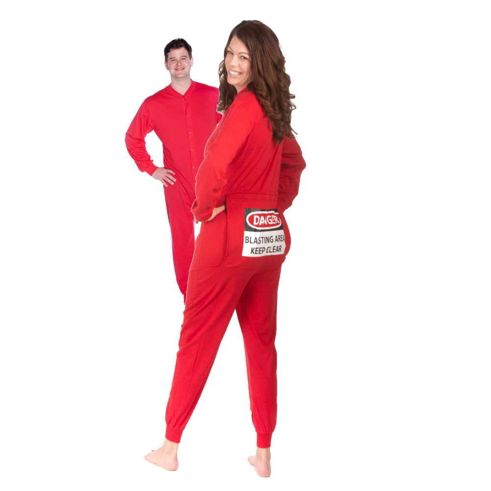 A couple wearing matching Red Cotton Knit Adult Footless Onesie Pajamas with Funny Butt-Flap - says DANGER - BLASTING AREA - KEEP CLEAR from Big Feet Pajama Company.