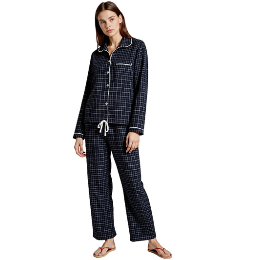 Woman wearing black & white windowpane plaid brushed cotton flannel 2 piece pajama set from Big Feet Pajamas