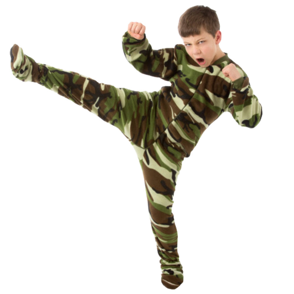 A boy practicing karate in his Green Camouflage Fleece Footed Onesie Pajamas for boys from Big Feet Pajama Company.