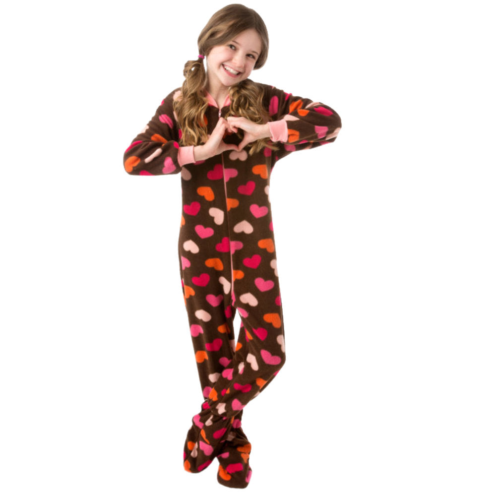 A girl wearing Chocolate Brown with colorful hearts all over Fleece Onesie Footed Pajamas for girls from Big Feet Pajama Company.