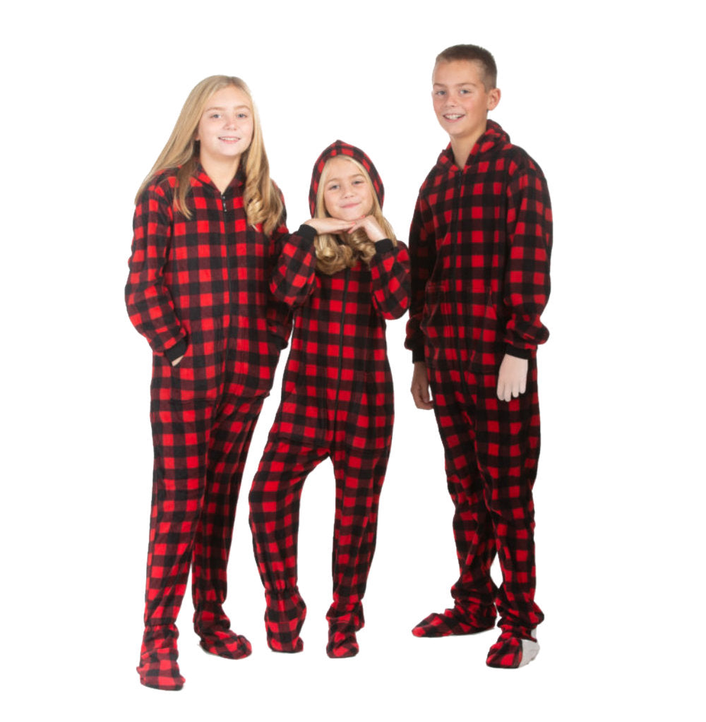 Boys and girls are wearing hoodie footie onesie pjs from the Big Feet Pajama Company line of family matching onesies pajamas. These one-piece outfits are made of Red & Black checkered buffalo fleece.