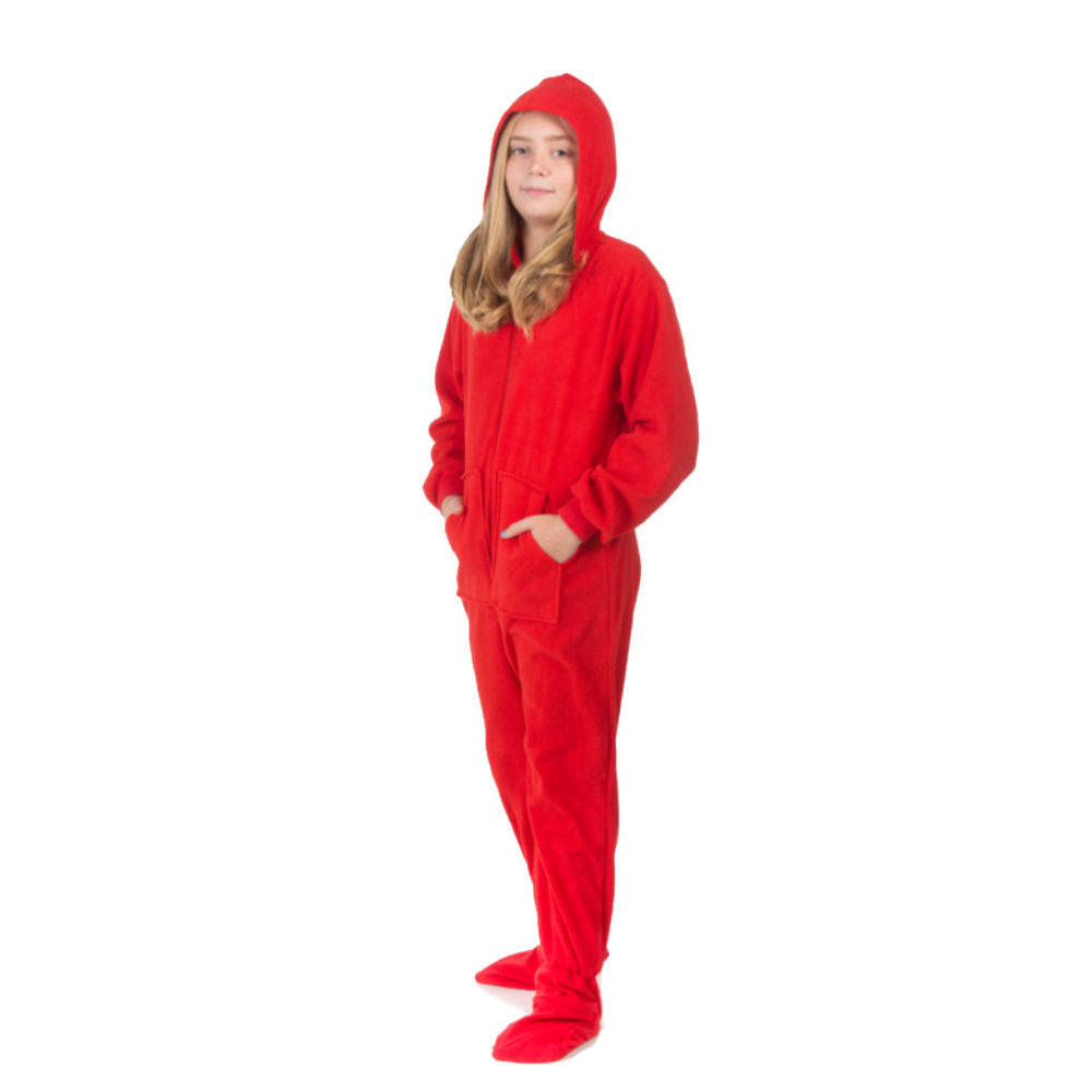 A girl wearing hoodie footed red fleece onesie pajamas from Big Feet Pajama Company.