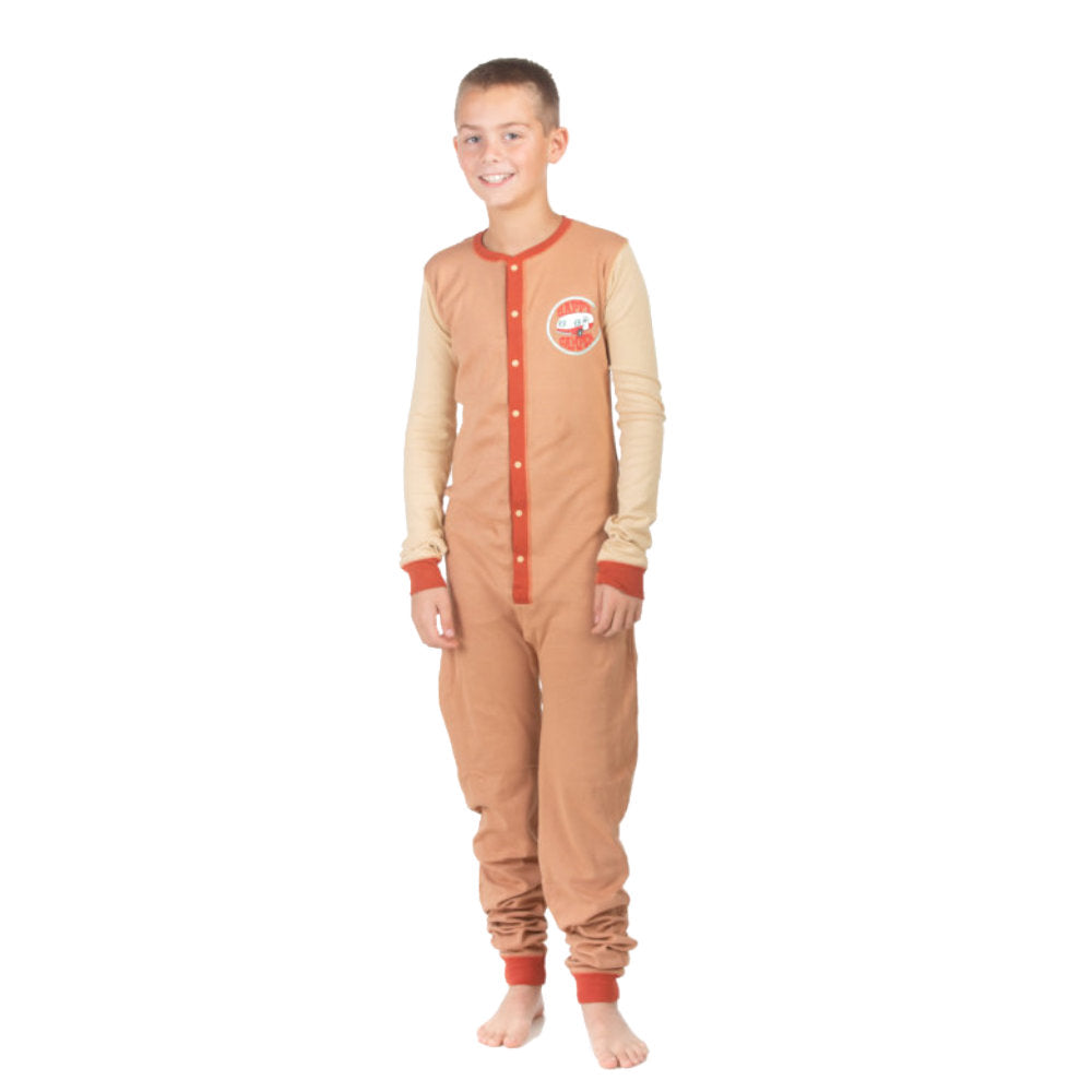 A boy wearing a brown and beige Happy Camper onesie from the Big Feet Pajama collection of 100% cotton Union Suit Sleepwear and Playwear. The onesies feature a "Happy Camper" badge on the chest. These onesies have long sleeves, cuffs, a snap-up front, and a decorative rear flap with the Happy Camper Bear and Moose by the fire at their campsite.