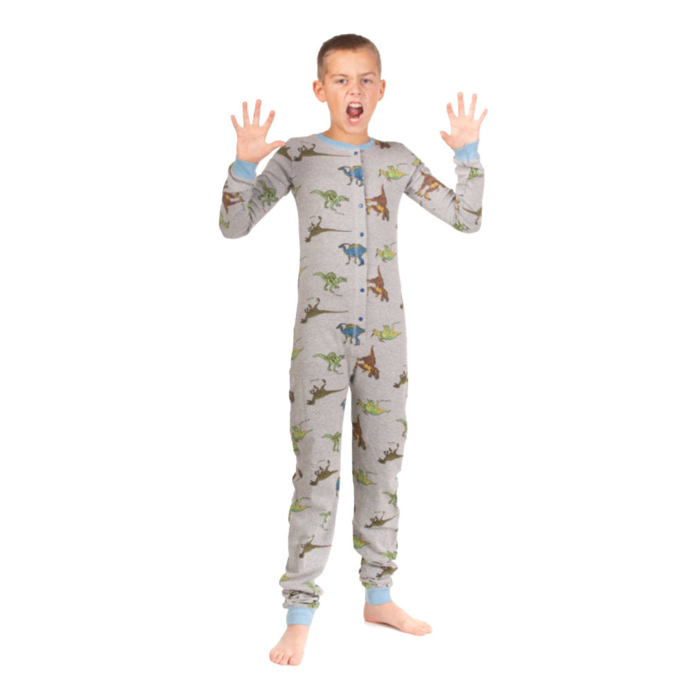 A boy wearing heather blue cotton footless onesies from Big Feet Pajama Company acting like a T-Rex dinosaur. His footless onesie has five different dinosaurs printed all over them.