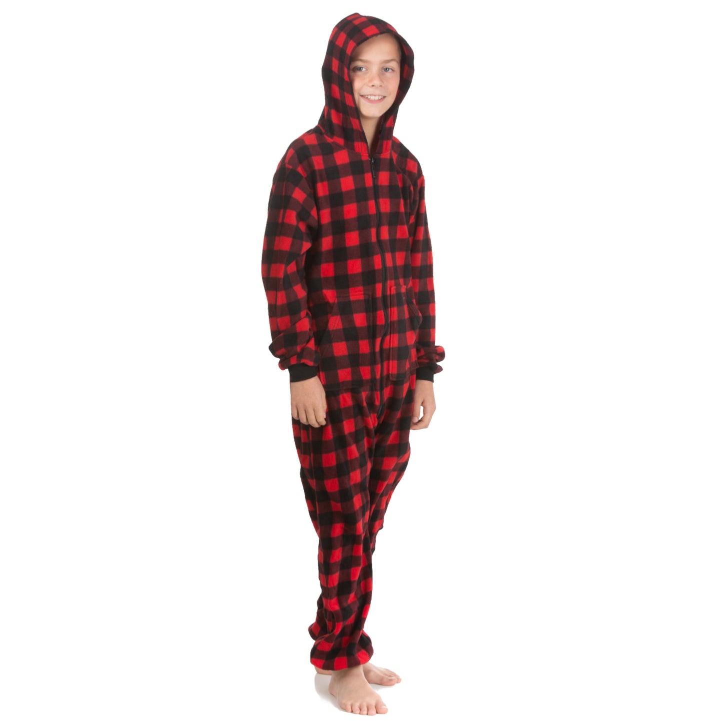 A boy wearing hoodie jumpsuit pjs from the Big Feet Pajama Company line of warm fleece onesies that make getting ready for bed and relaxing at home easy. This one-piece outfit is made of Red and Black Buffalo plaid micro-polar fleece.