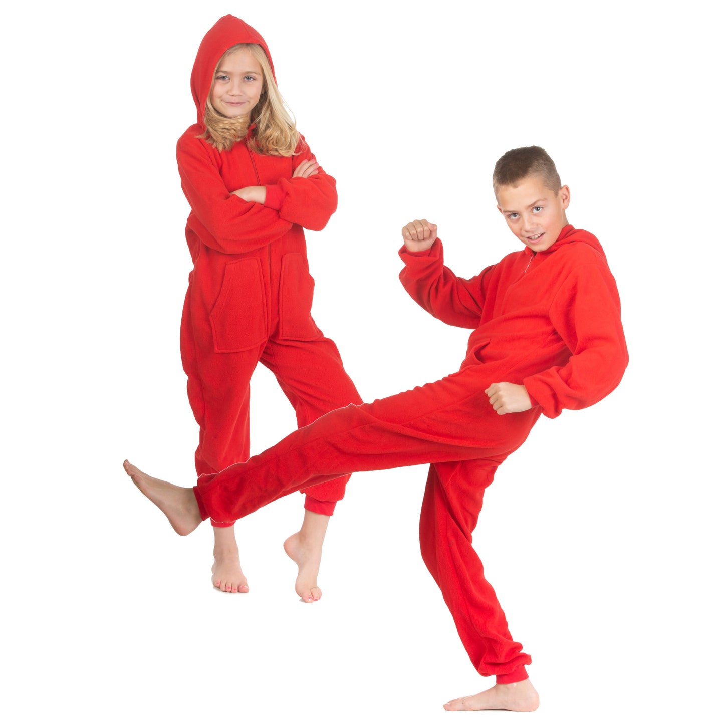 A boy and girl are wearing hoodie jumpsuit pjs from the Big Feet Pajama Company line of family matching onesies pajamas. This one-piece outfit is footless and made of Red micro-polar fleece.