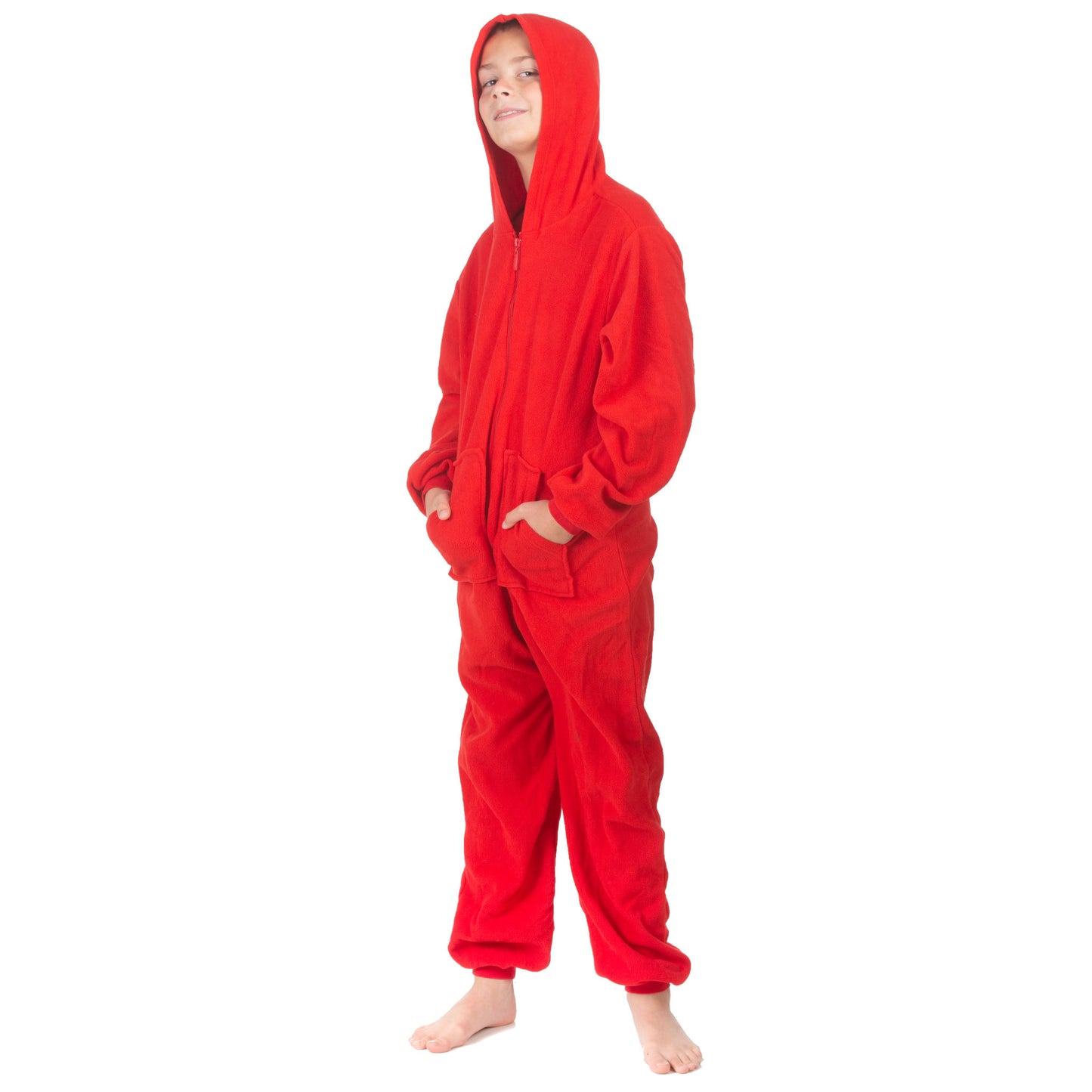 A kid is wearing jumpsuit pjs from the Big Feet Pajama Company line of warm fleece footless onesies that make getting ready for bed and relaxing at home easy. This outfit is made of red fleece, and he is posing with his hood on and hands in the kangaroo pockets.