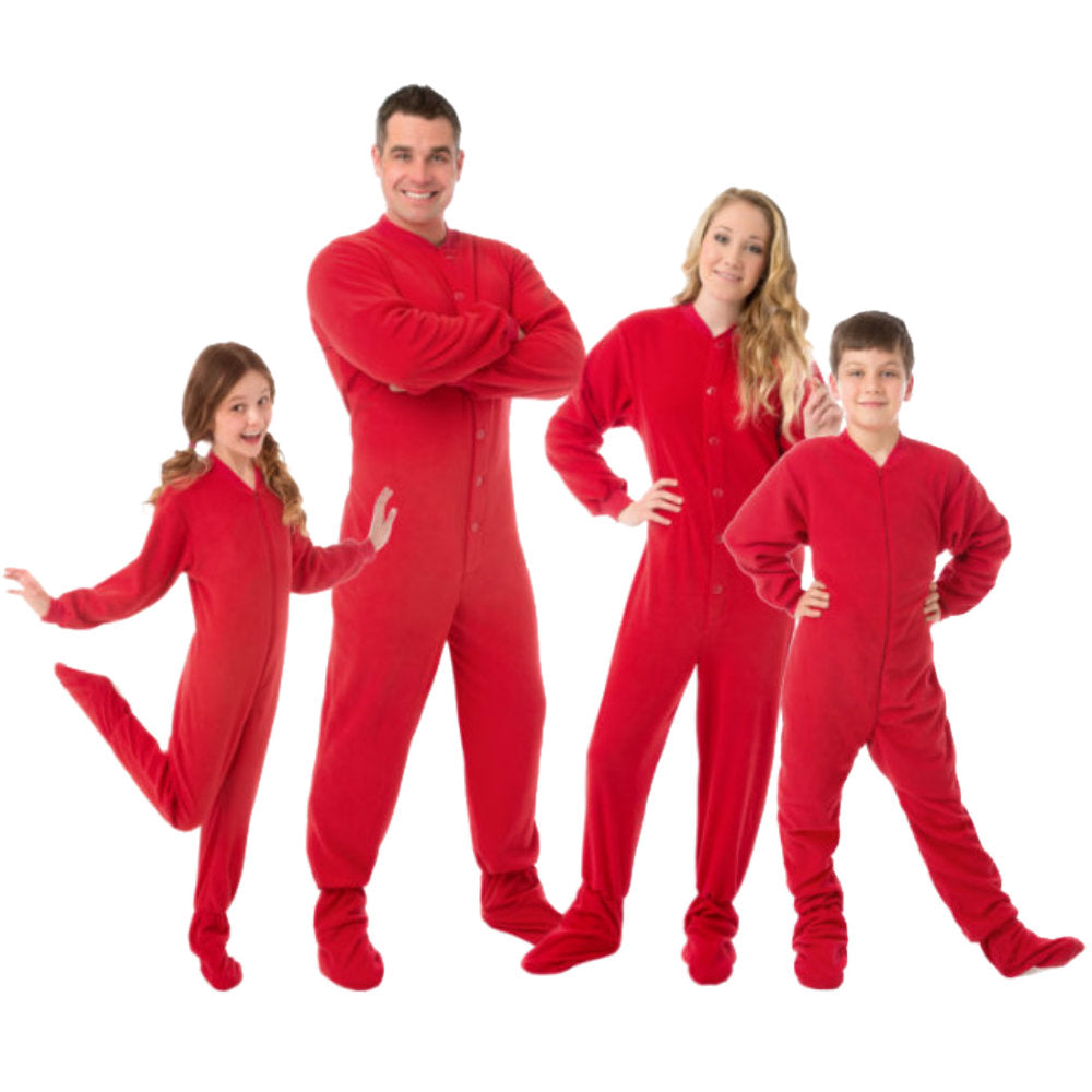 The entire family ready Christmas Card pictures. Everyone is wearing matching Red Fleece Onesie Footed Pajamas from Big Feet Pajama Company.