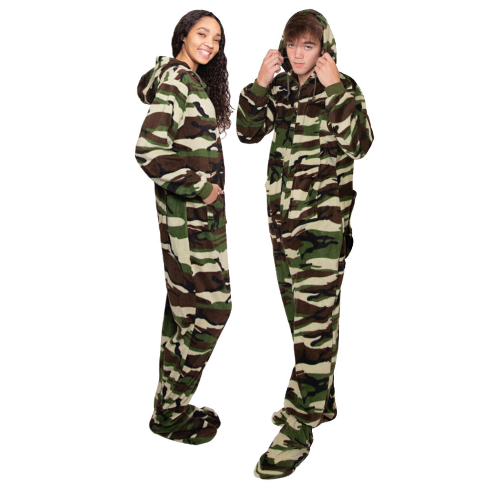 A girl and a guy, wearing matching Green Camouflage Fleece Adult Onesie Hoodie Footie Pajamas from the Big Feet Pajama Company