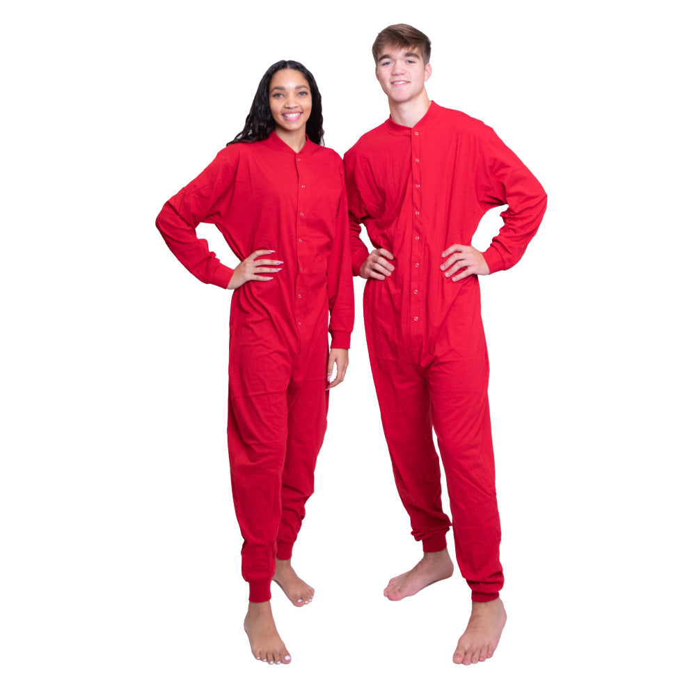 A couple wearing matching Red Cotton Knit Adult Footless Onesie Pajamas for Christmas pictures from Big Feet Pajama Company.